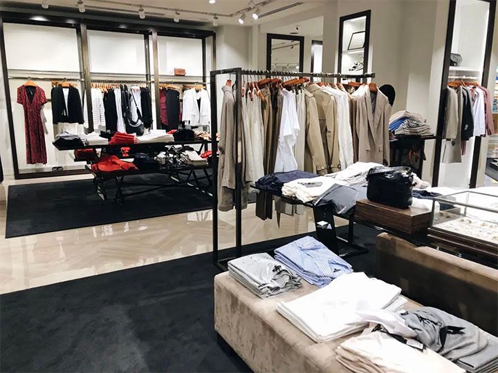 A clothing store with a lot of clothes on display