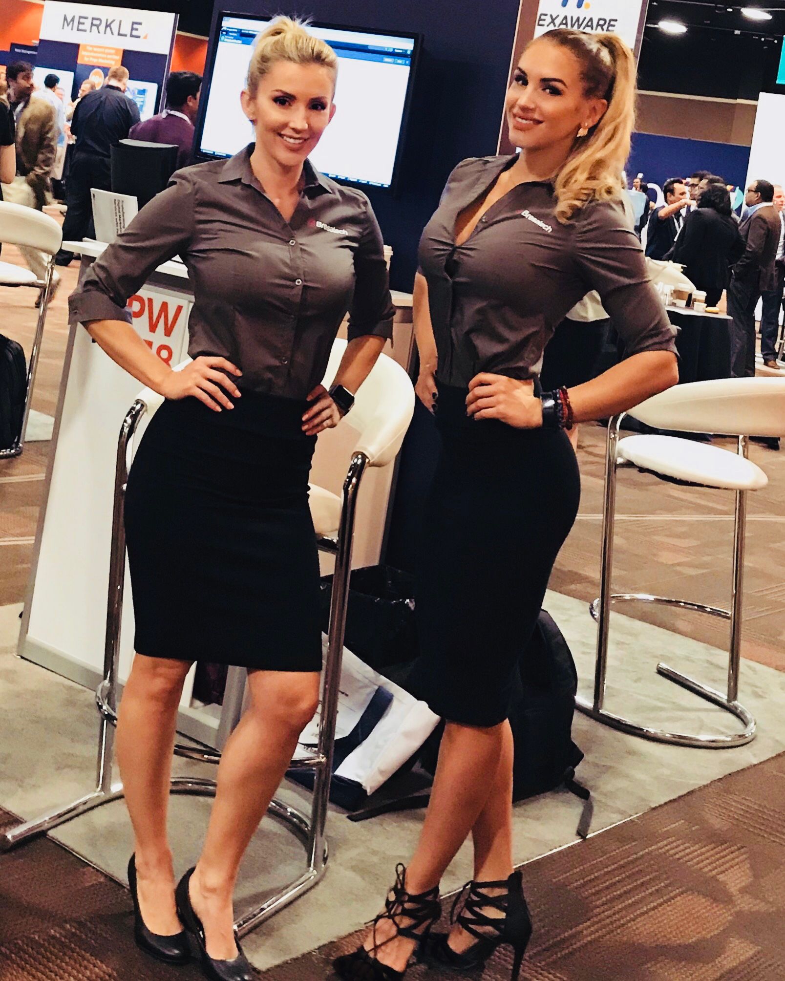 Professional conservative booth models greet attendees at Affiliate Summit conference in Las Vegas.