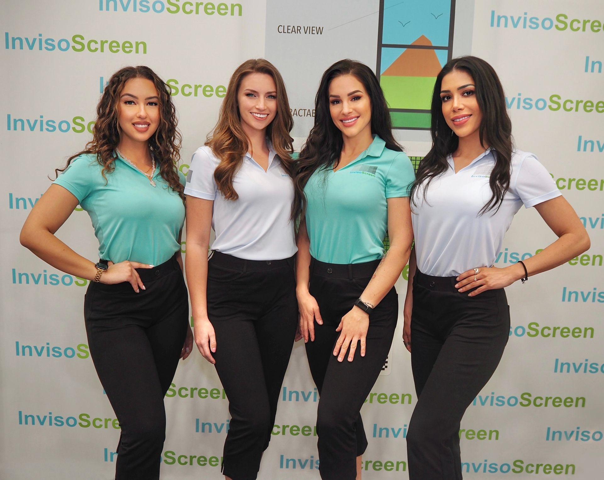 Booth hostesses smile in branded polos at the National Hardware Show in Las Vegas 2025.