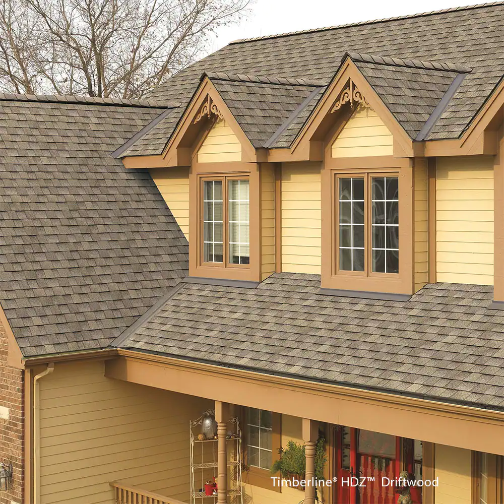 A house with a roof that has shingles on it
