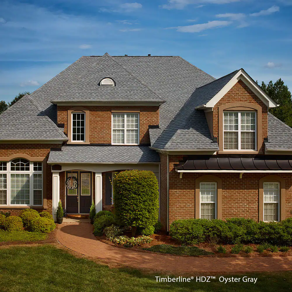 A large brick house with a gray roof