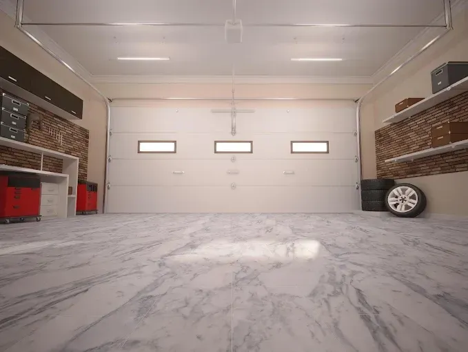 Empty modern garage with marble floor, white walls, and three small windows on the back door.