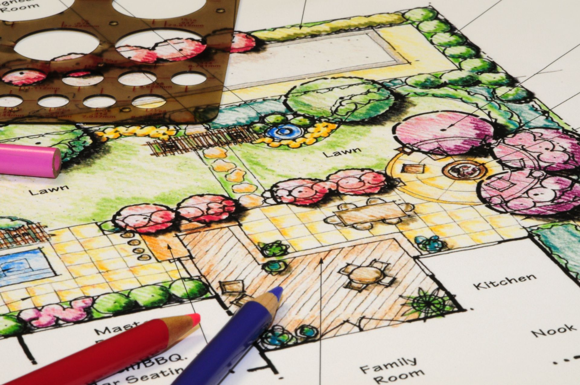 A drawing of a garden with a stencil and colored pencils