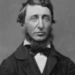 Man with dark hair and beard, wearing a suit and bow tie; a portrait.
