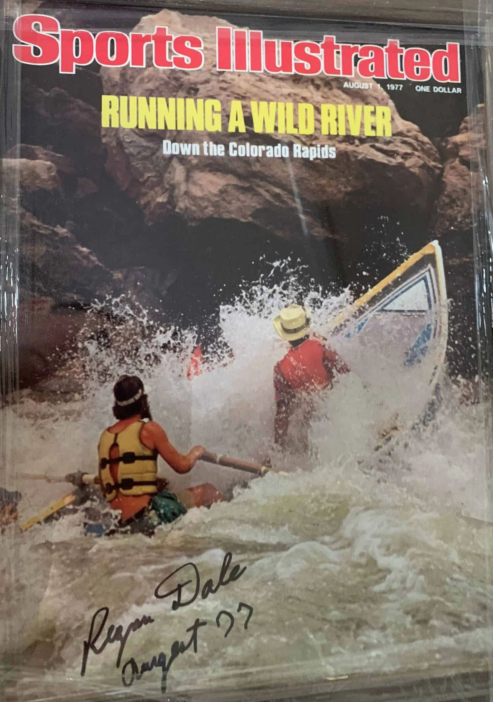 Sports Illustrated cover: Two people in a boat navigating whitewater rapids.