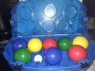 Blue plastic bocce ball set with colorful balls: blue, yellow, red, and green.