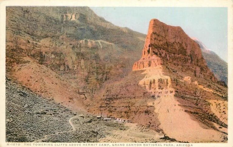 Vintage postcard of a canyon, with a large rock formation and a camp below.