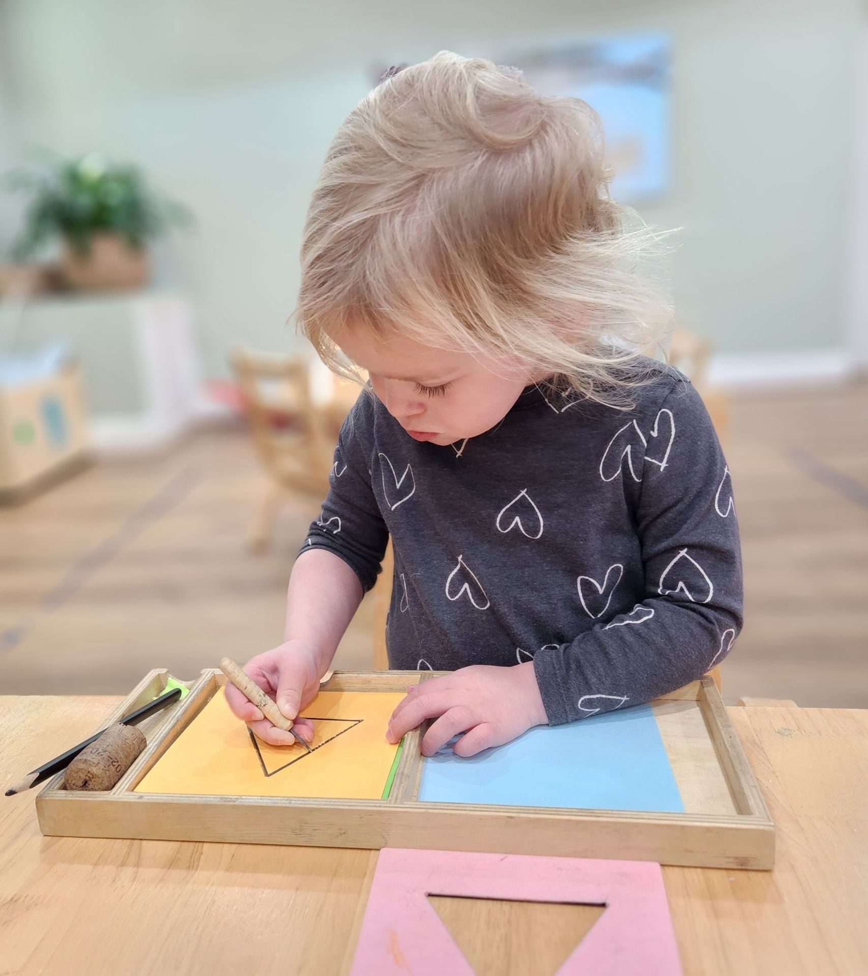 montessori toddler holding book
