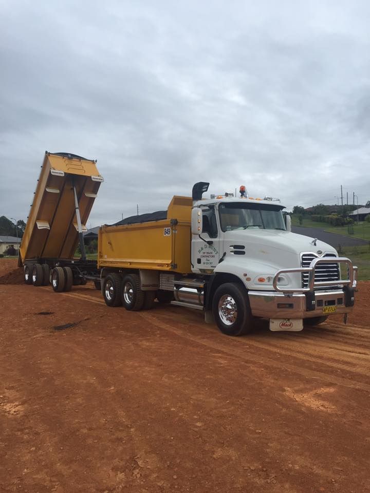 A White and Yellow Tipper Truck — B & D Bunt Earthmoving Contractors in North Boambee Valley, NSW