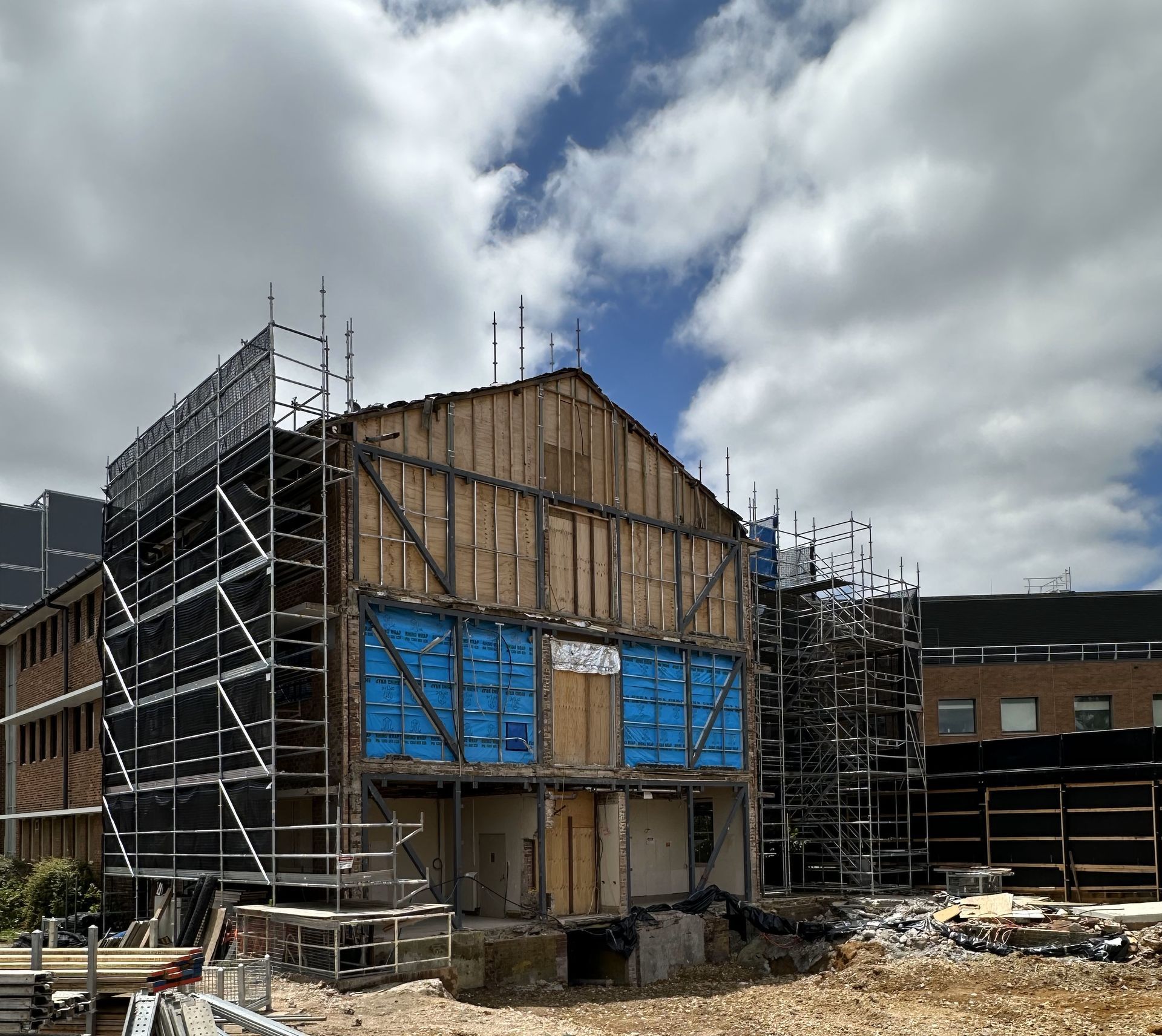 A large building under construction with scaffolding around it