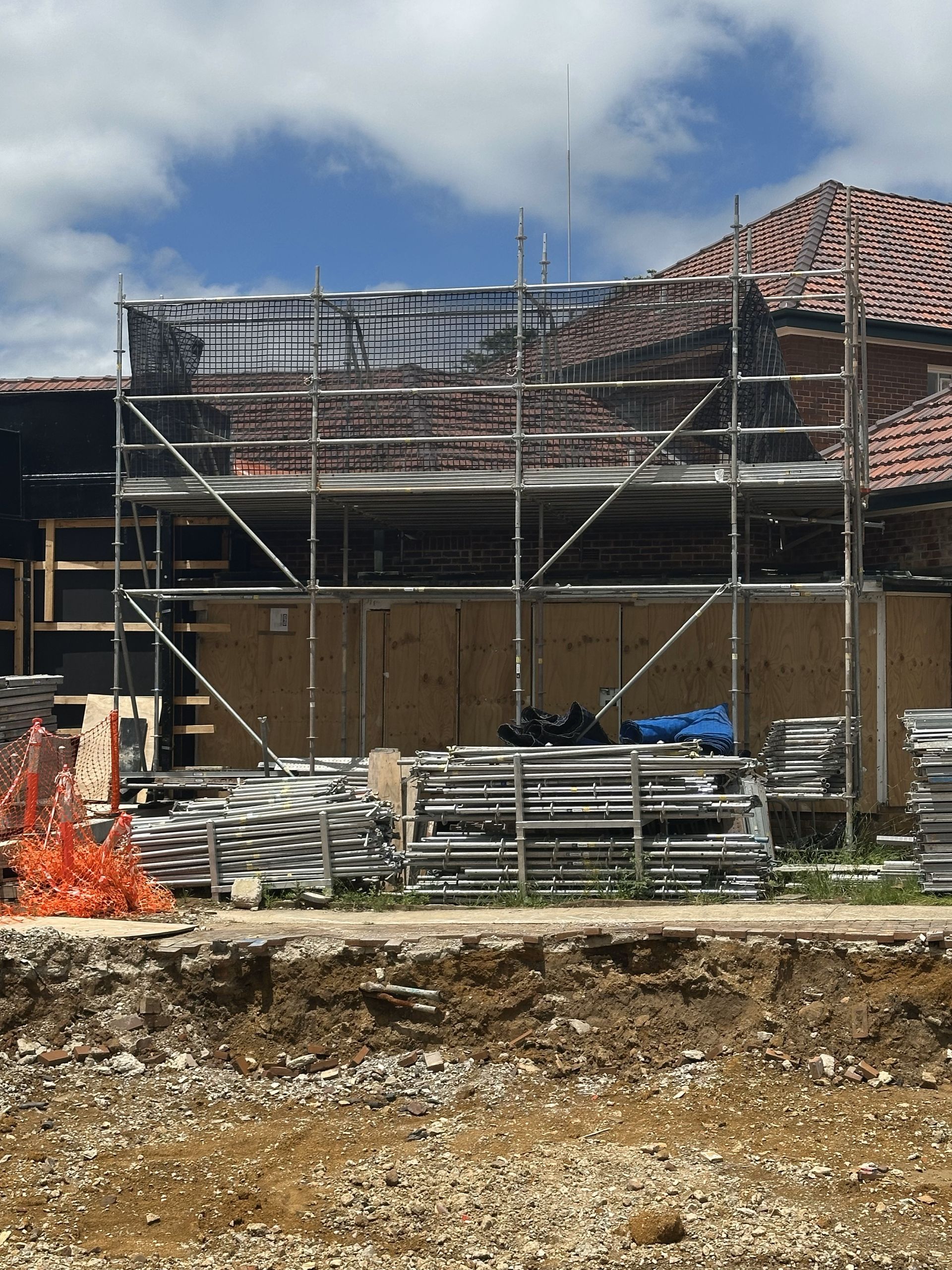 A building under construction with scaffolding around it