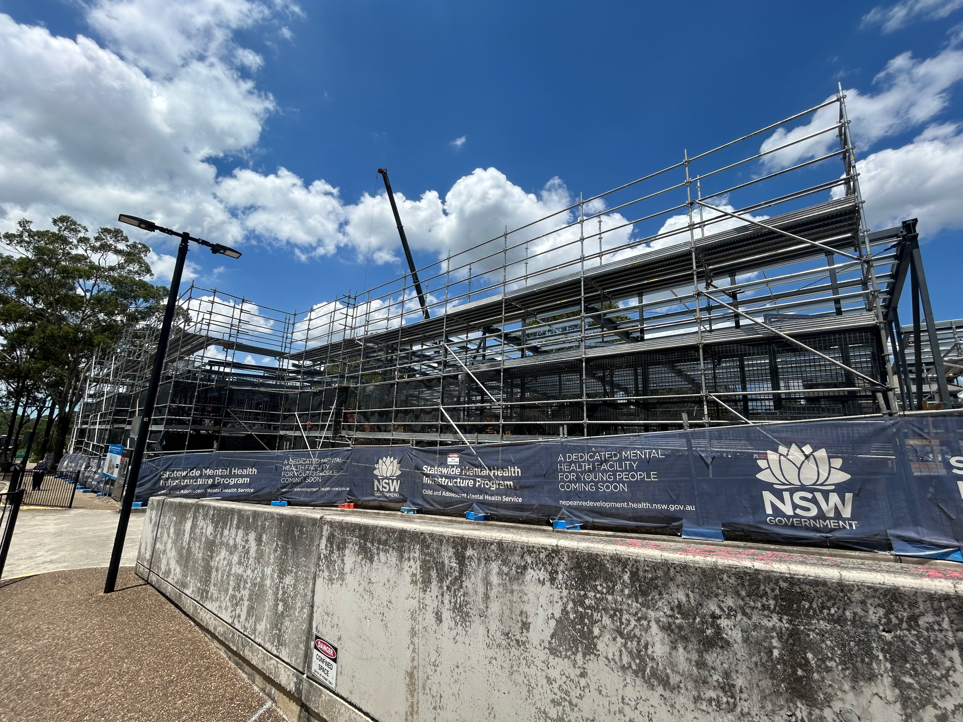 A large building under construction with scaffolding on top of it.