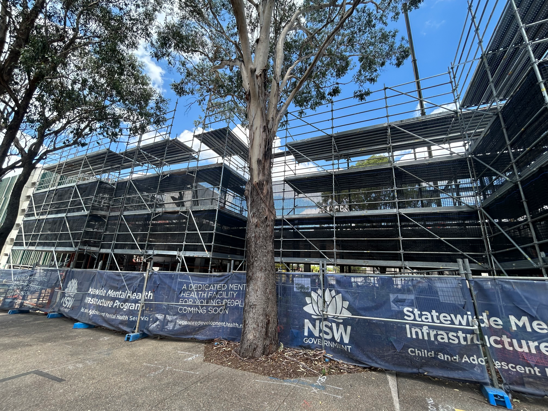 A large building is being built with scaffolding around it.