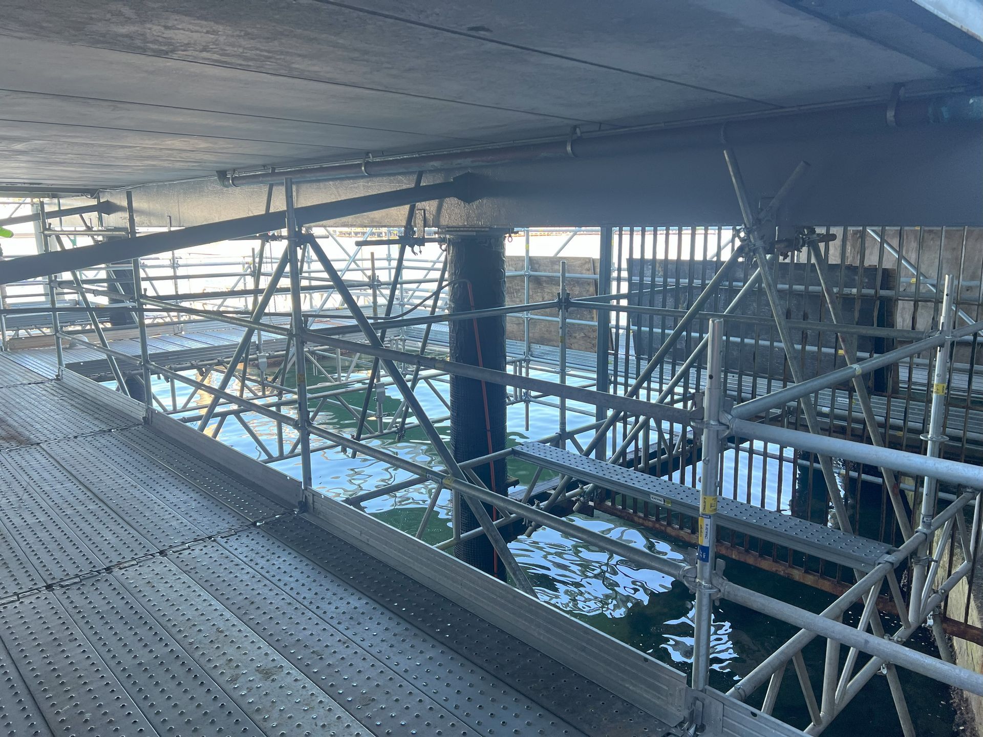 A bridge is being built over a body of water.