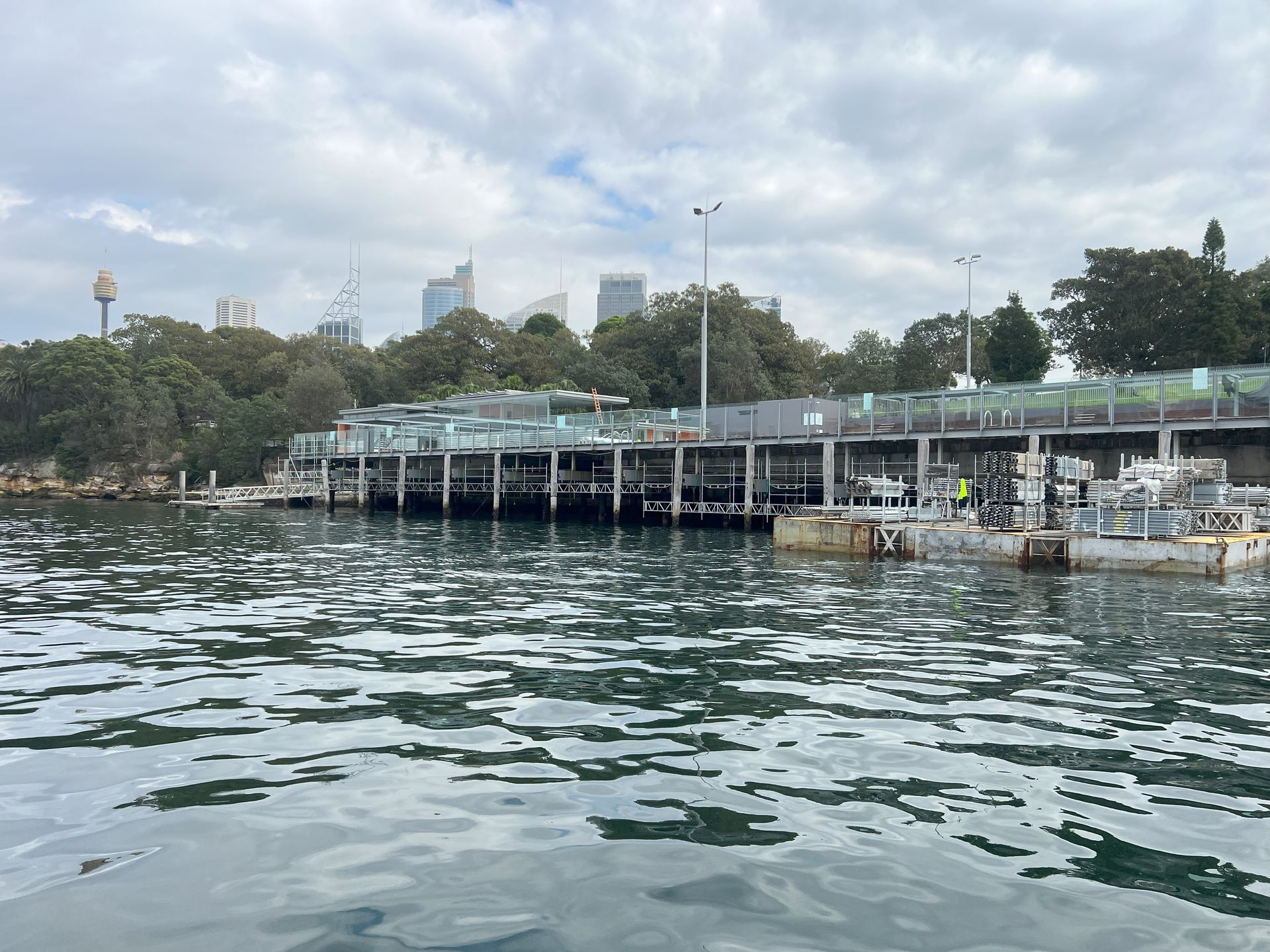 A large body of water with a dock in the background.