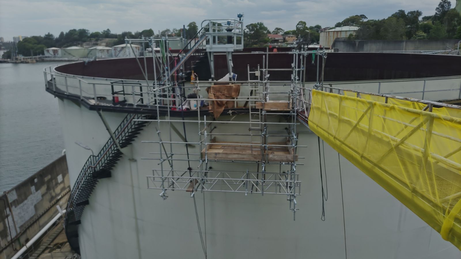 An aerial view of a bridge being built over a body of water.