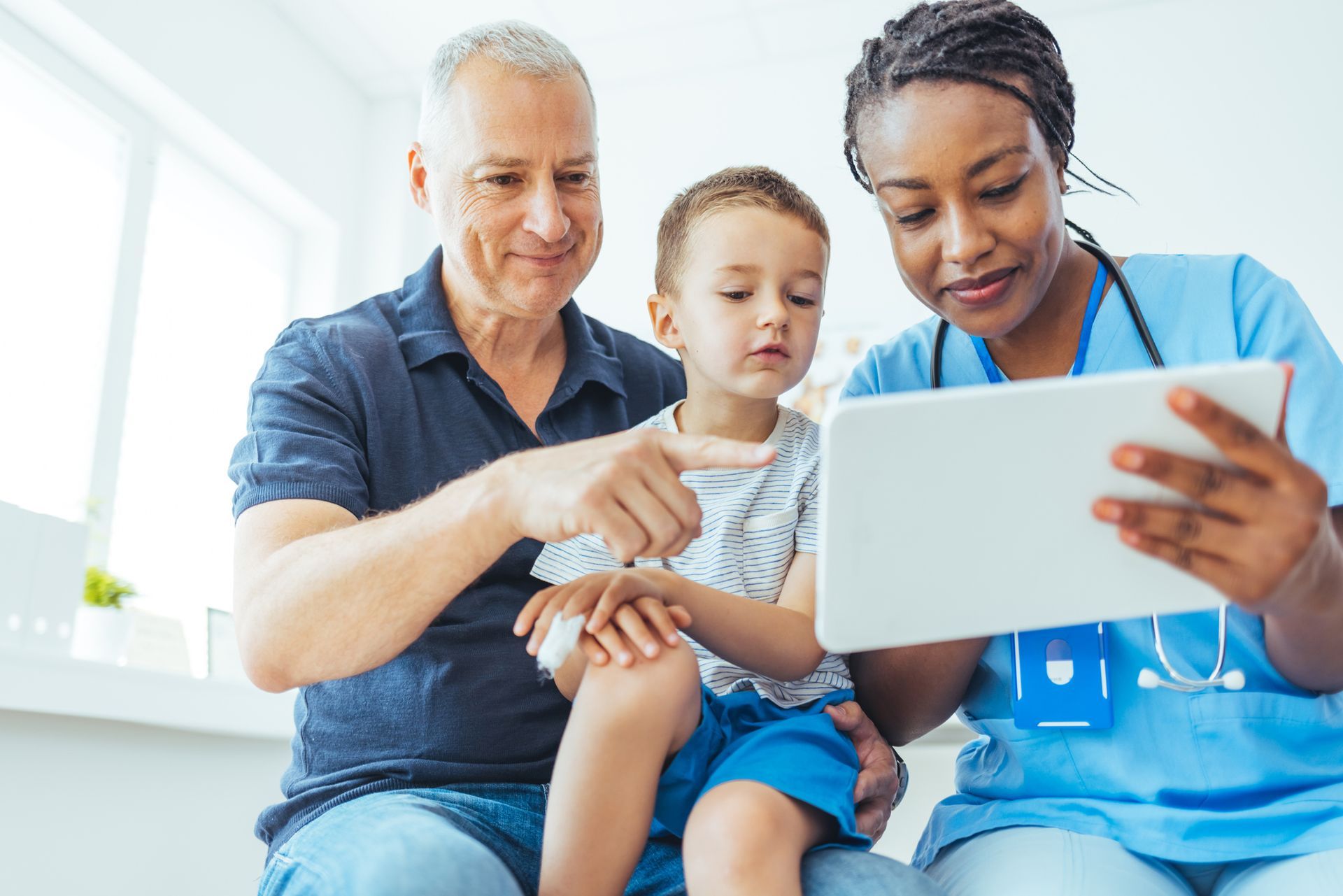 Young Boy Sitting — Chelmsford, MA — Chelmsford Pediatrics