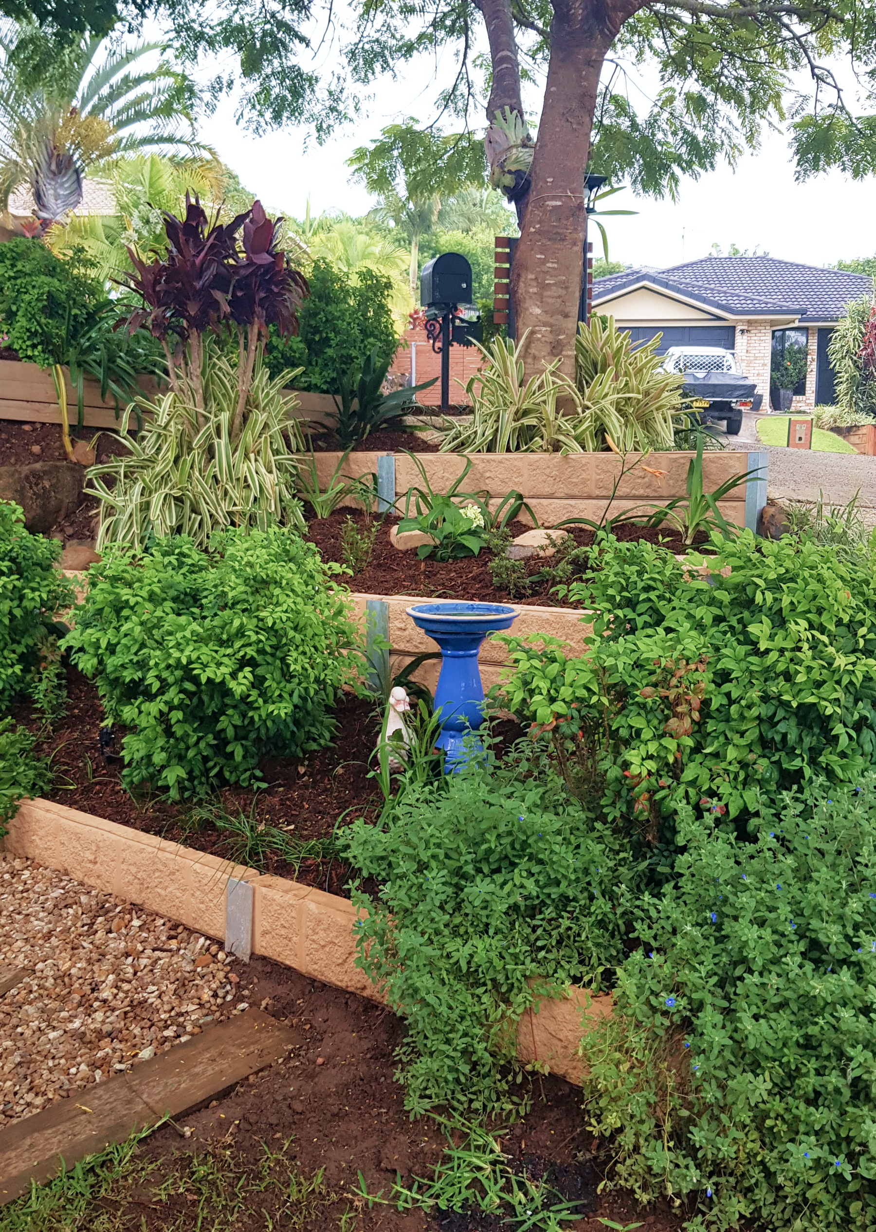 Mulched Garden With Bird Bath and Duck Statue — Teven Valley Tea Tree Mulch In Lennox Head, NSW