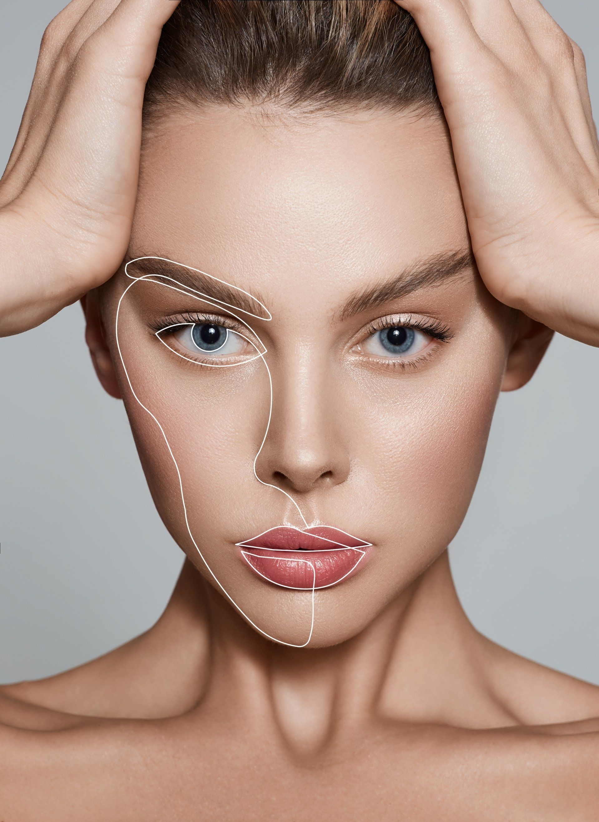 A close up of a woman 's face with lines drawn on it