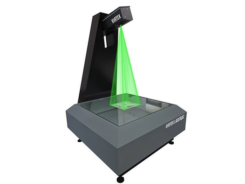 Laser scanner projecting a green beam onto a square object on a glass surface. Grey and black machine.