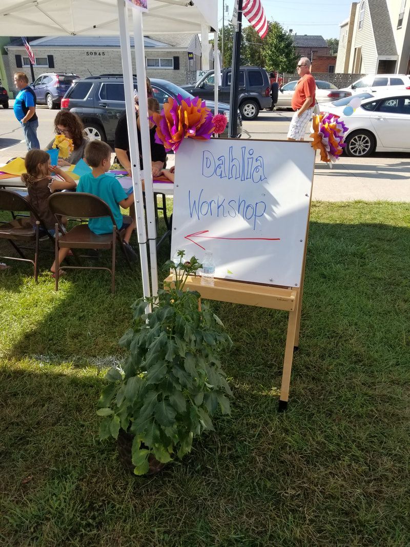 A white board with the words dahlia workshop on it