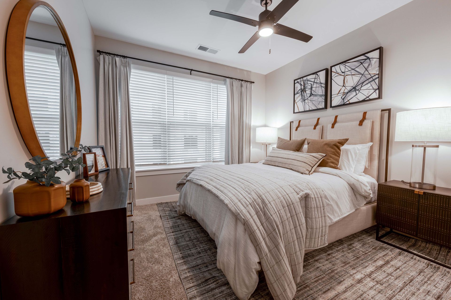 apartment bedroom with ceiling fan and window at Federal Hill in Noblesville, IN.