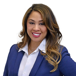 Smiling woman in a blue blazer and white shirt on a white background