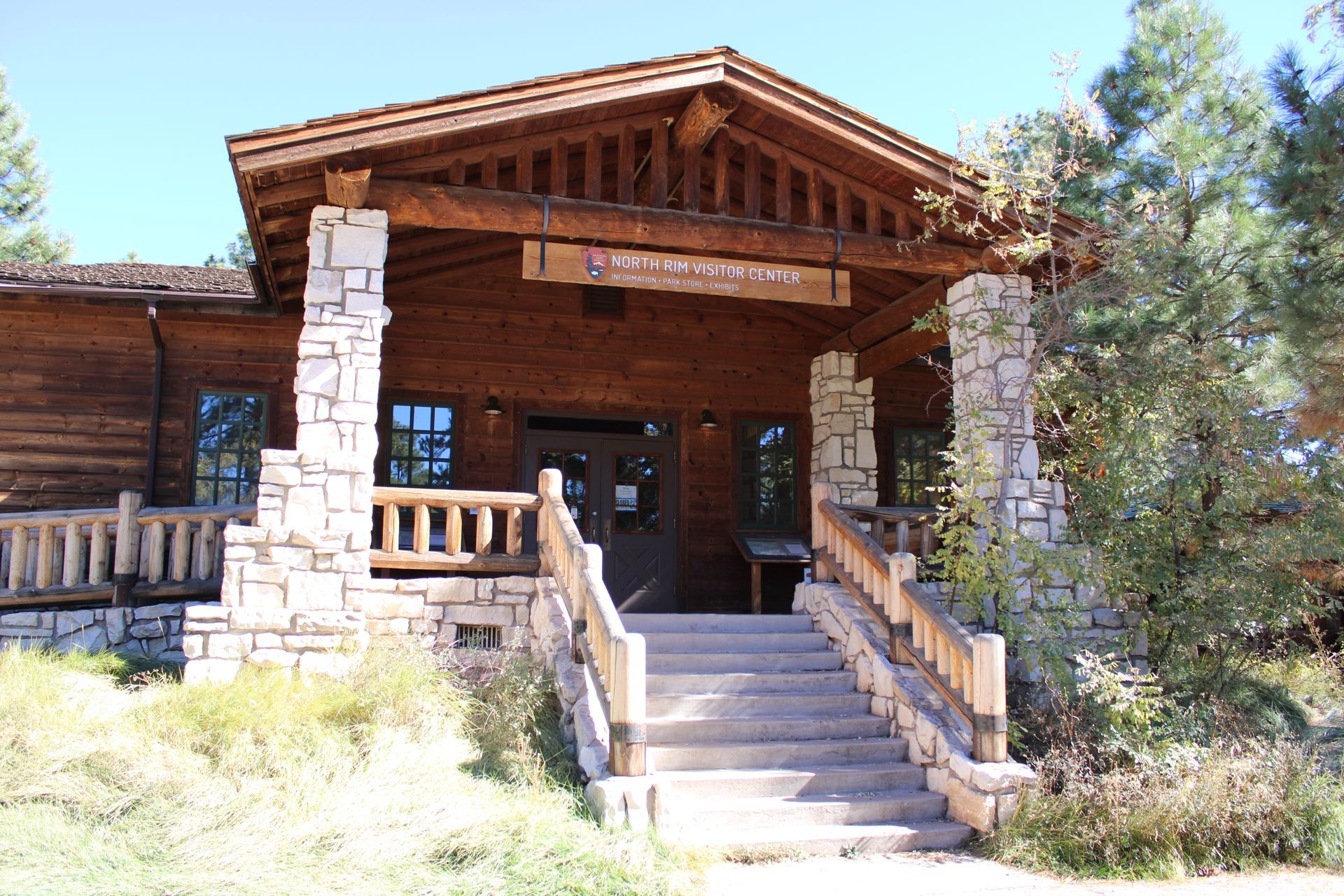 A wooden building with stairs leading up to it