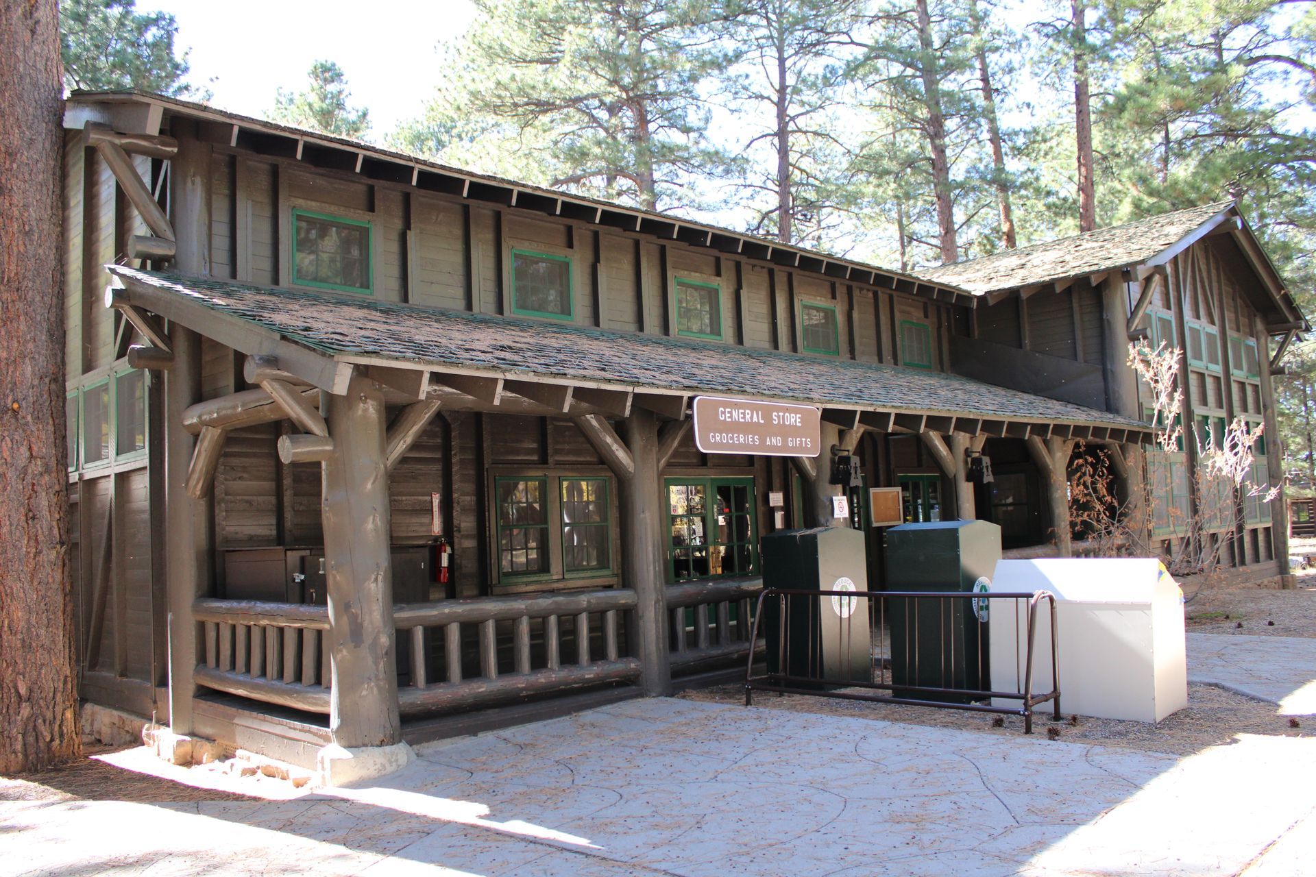 A large wooden building with a sign that says welcome