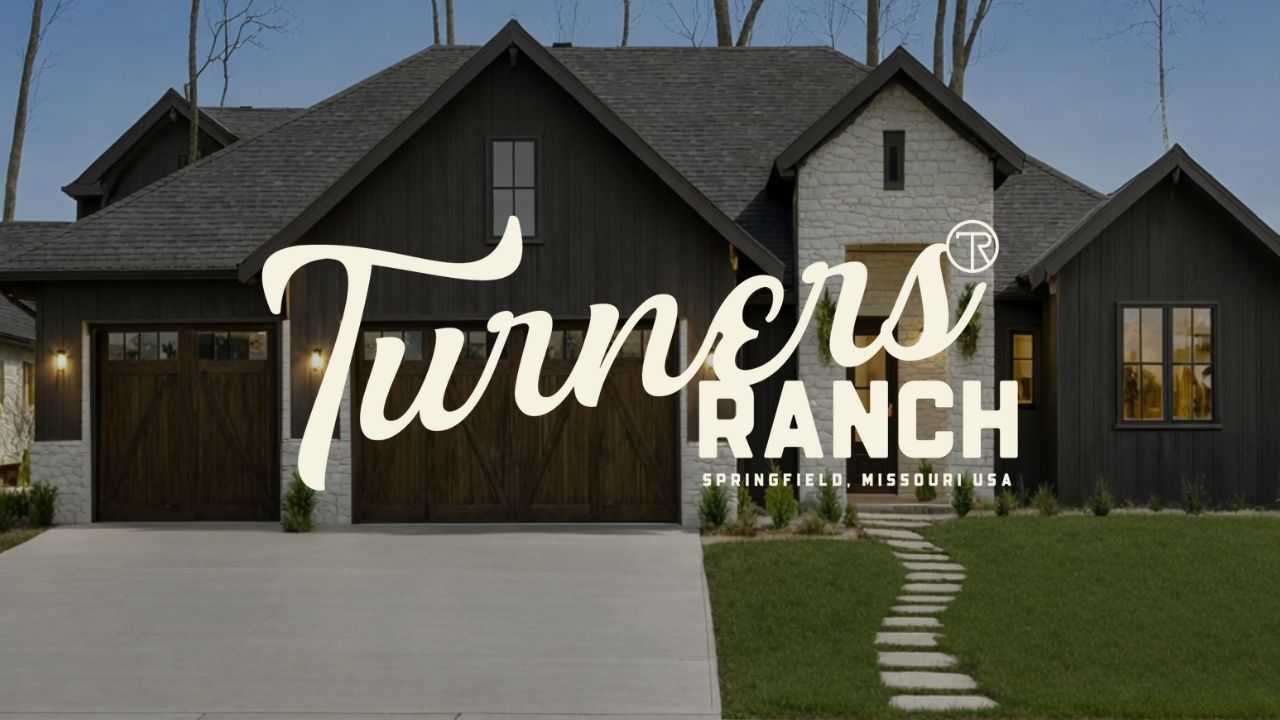 Turners Ranch logo over a modern farmhouse with lit porch and stone walkway at dusk
