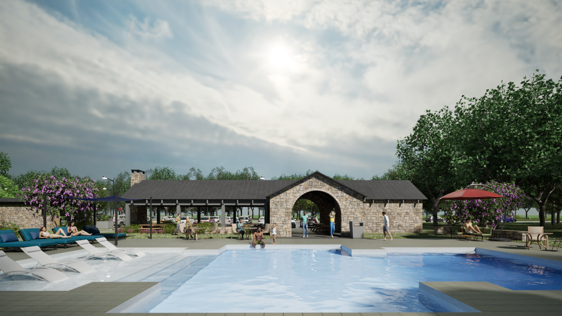 Outdoor pool with lounge chairs and a stone clubhouse under a cloudy sky