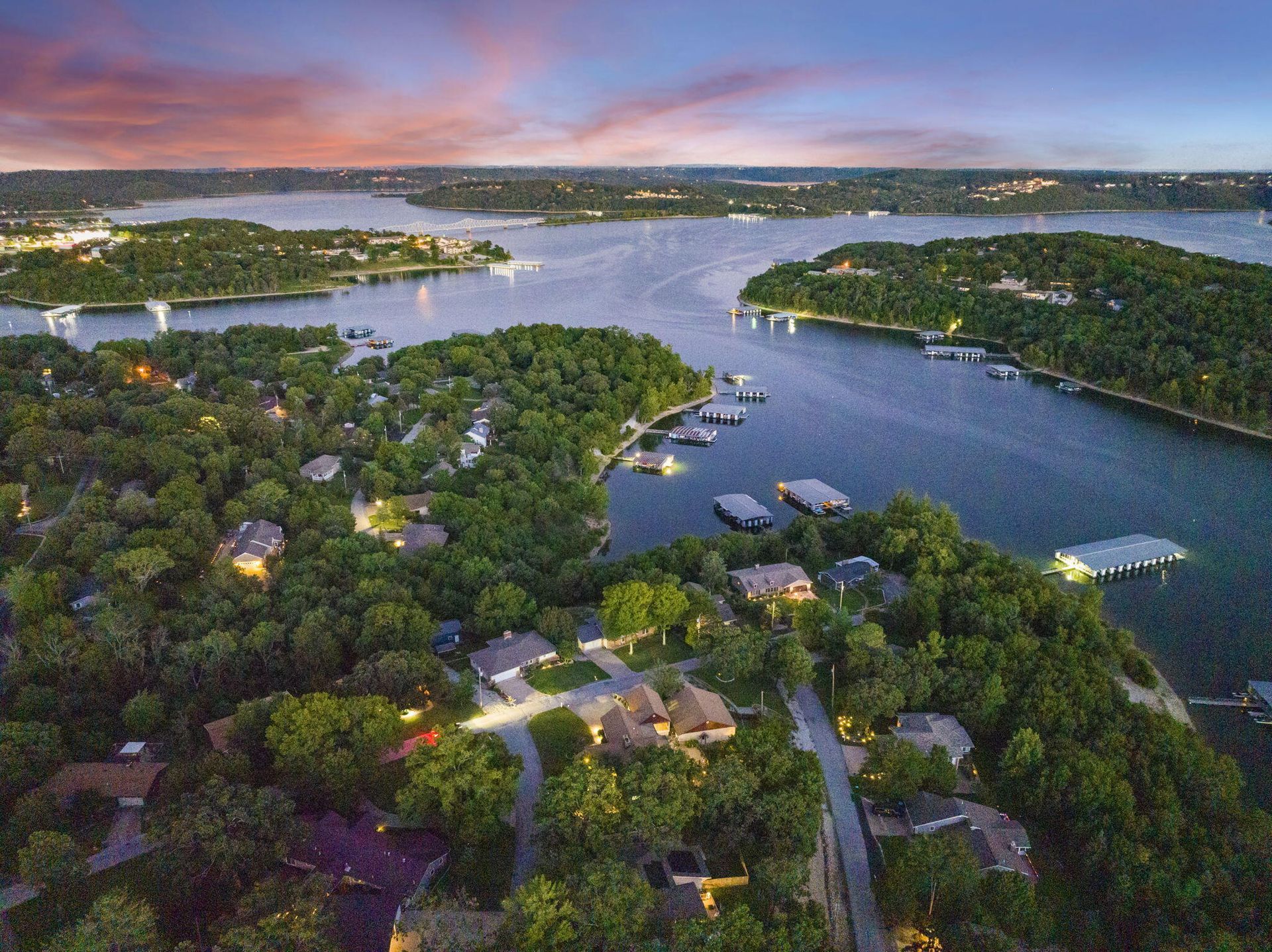 Aerial sunset view of waterfront homes and private docks along Table Rock Lake in Kimberling City MO