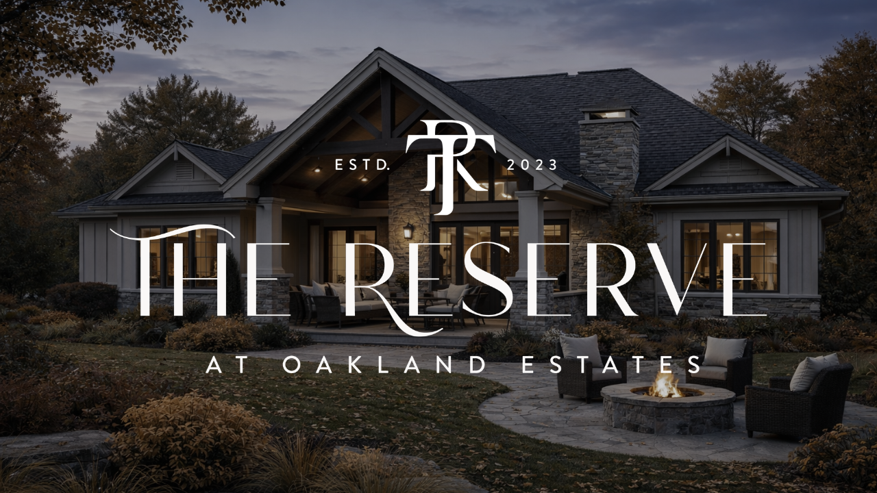 The Reserve at Oakland Estates logo over a dark luxury home exterior at dusk