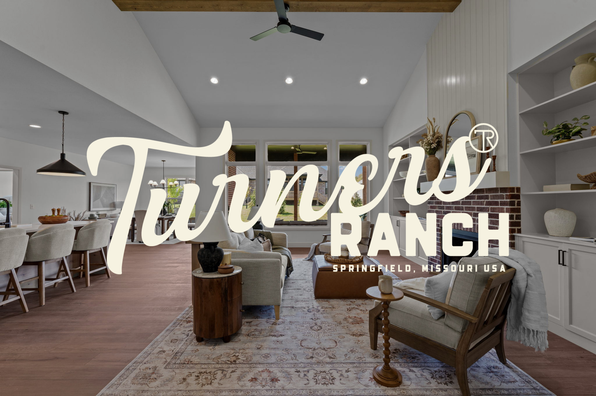 Turners Ranch logo over a modern farmhouse with lit porch and stone walkway at dusk