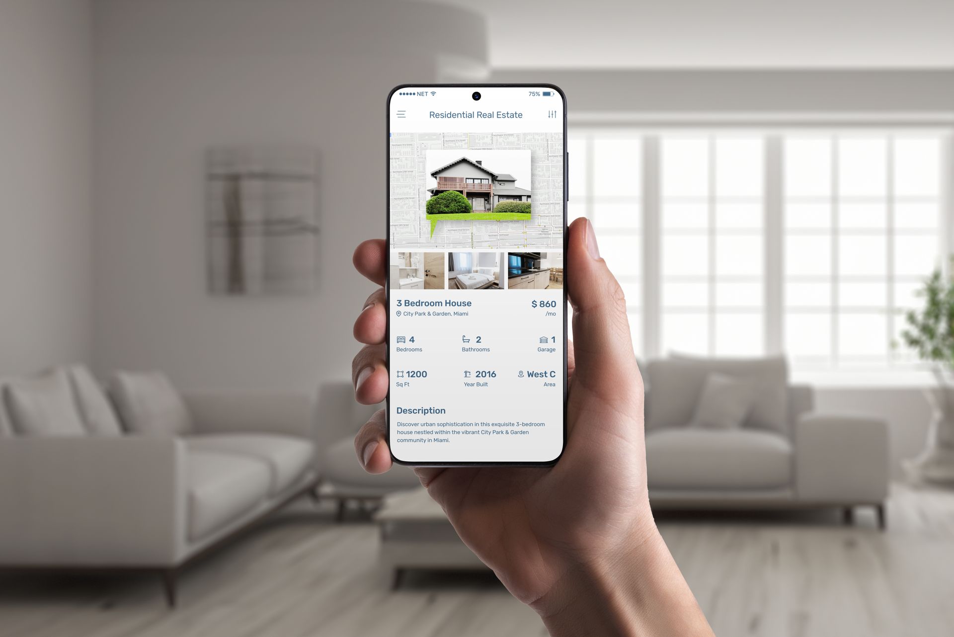 Hand holding a smartphone showing a house listing in a bright living room