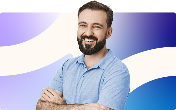 Smiling bearded man in a light blue shirt with arms crossed against a blue and white abstract background