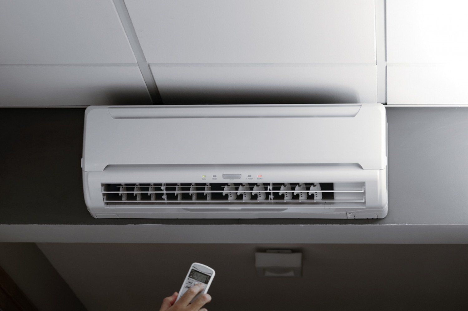 Hand controlling the aircon