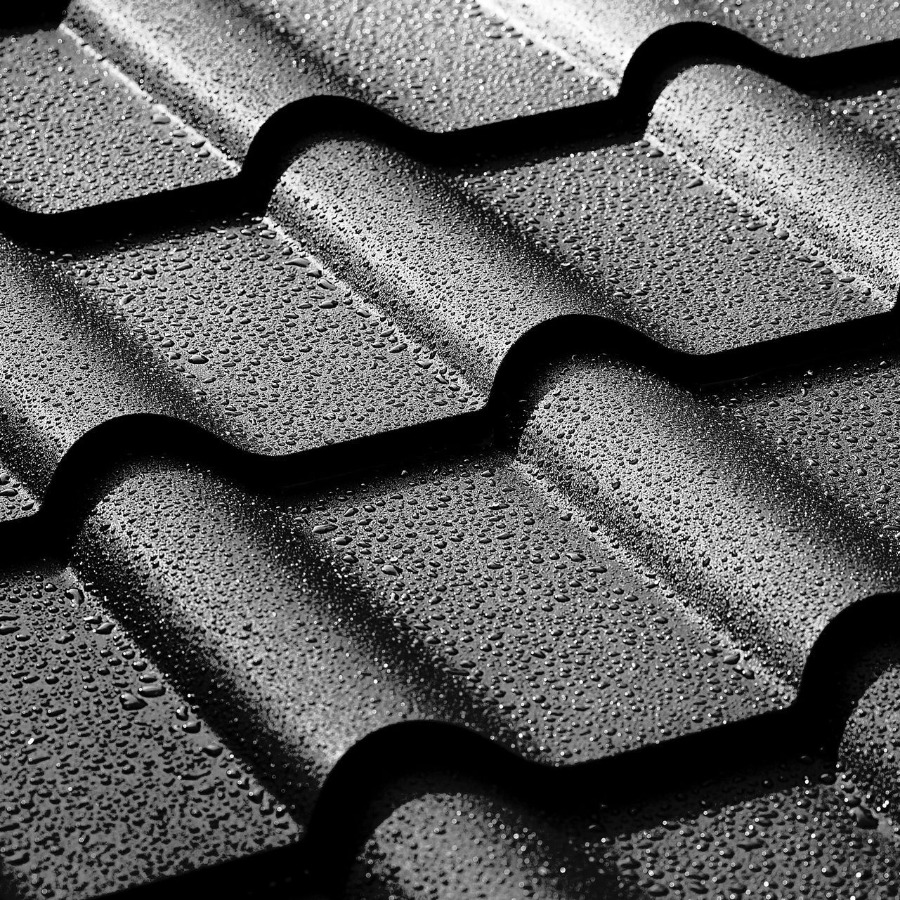 A roof with black tiles on it