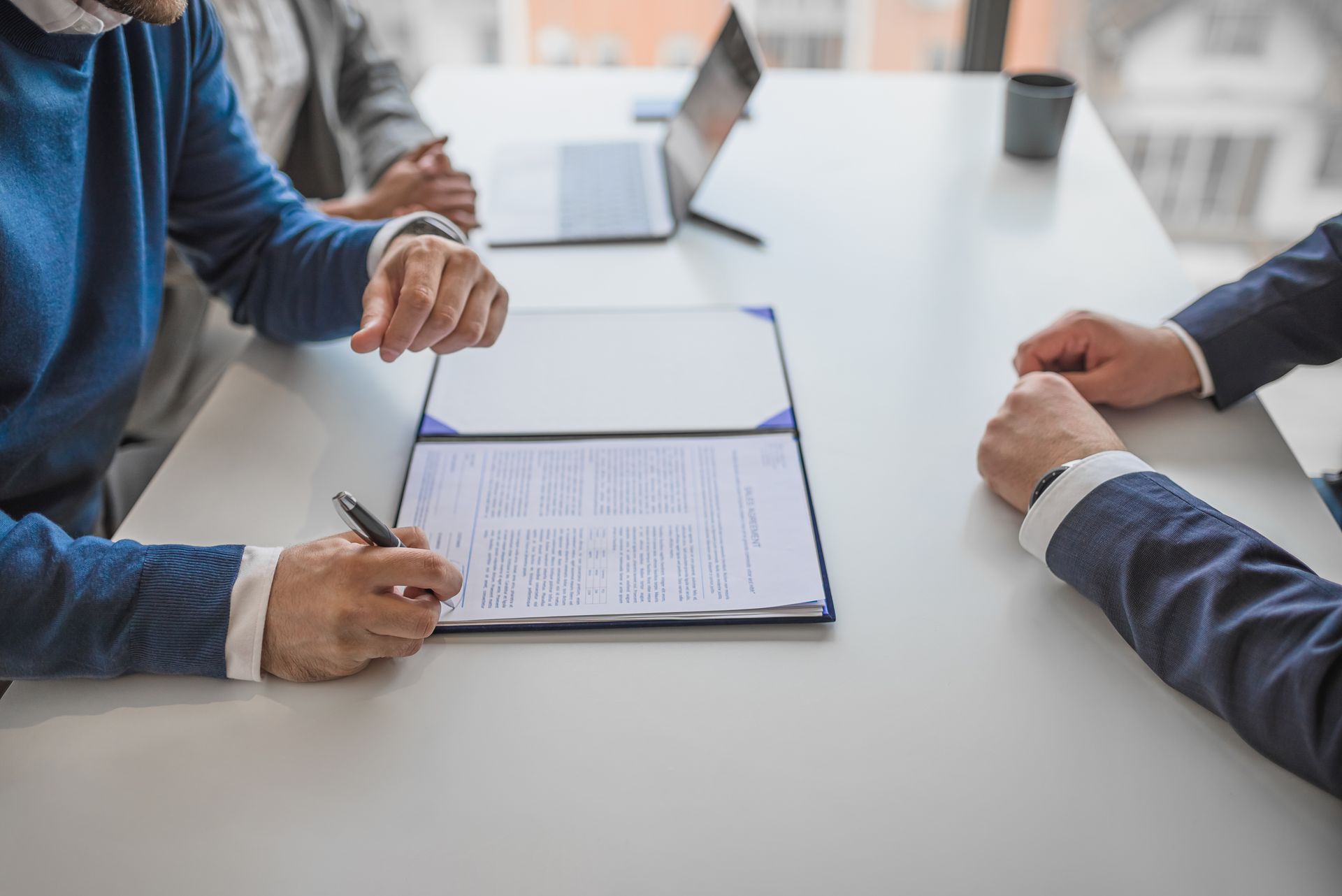 men looking over Insurance Clauses