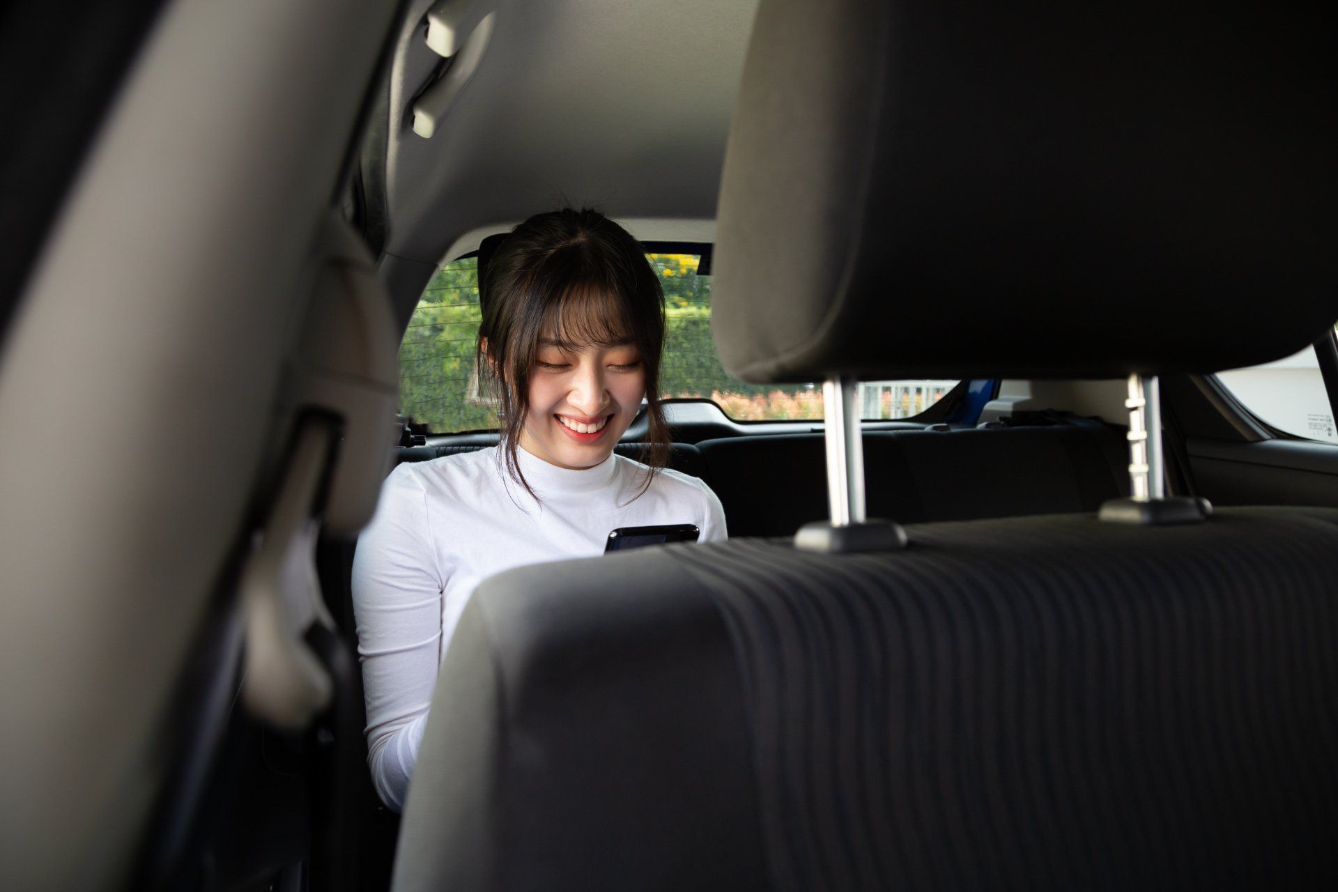 woman in the back of an Uber
