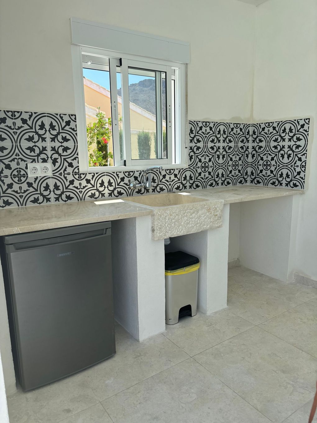 outdoor kitchen under the porch