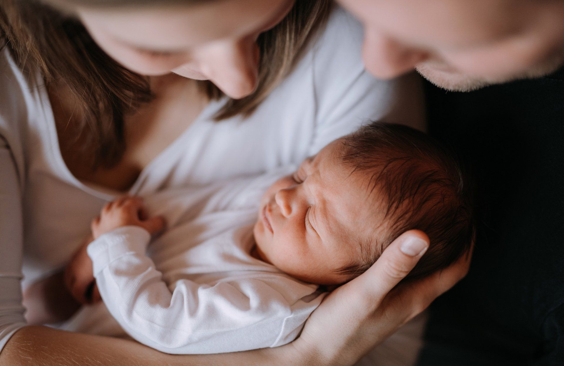 Parents holding baby