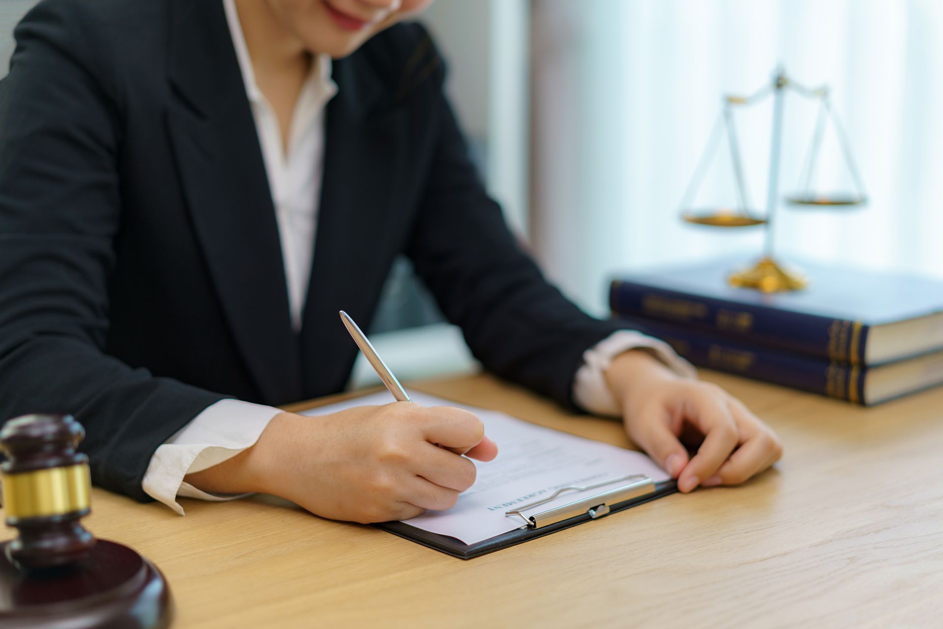 Lawyer signing agreement