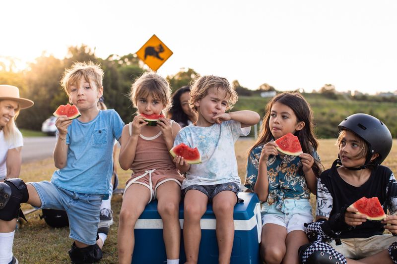 Kids eating watermelon