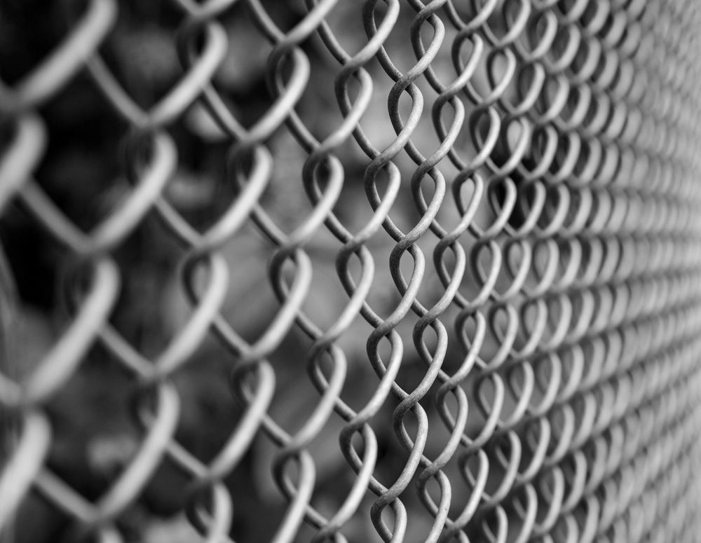 Close-up of a Silver Chain-link Fence in Black and White, With Shallow Depth of Field — Fencing Around in Garbutt, QLD