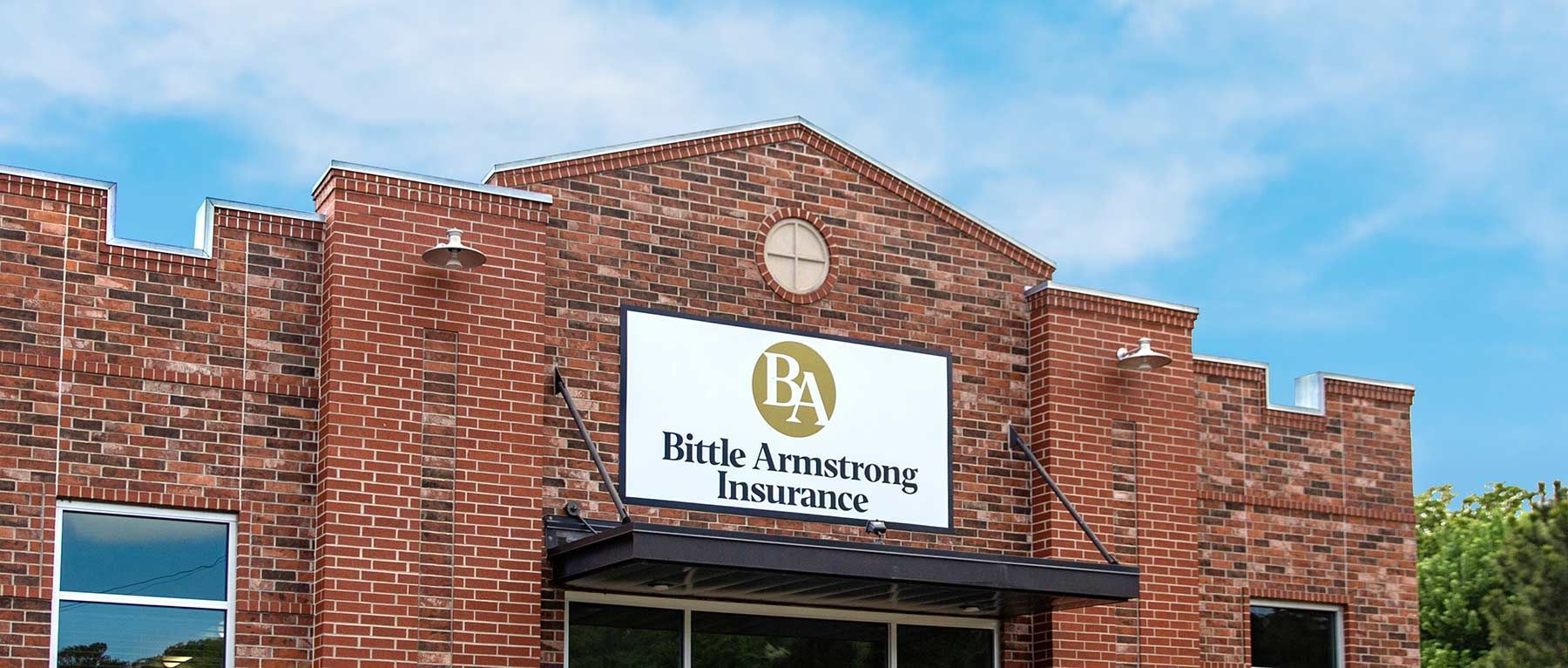 A red brick building featuring a sign that reads 