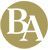 A circular gold emblem featuring the capital letters 