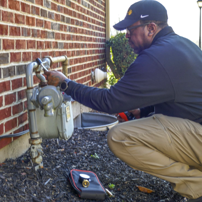 Antoine Towers inspecting Gas meter