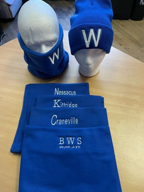 Royal blue winter gear, including two beanies, neck gaiters with 