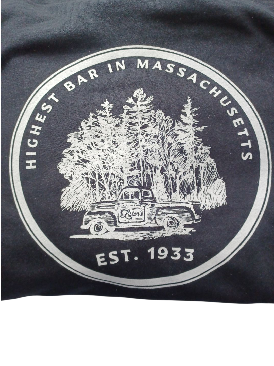 Graphic with a vintage truck in front of pine trees, text 